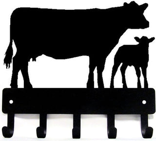 A metal cow and calf cut from the metal and with 5 hooks for hanging keys.
