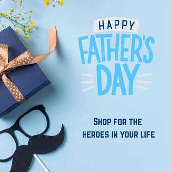 A chalkboard that says I heart Dad, and a box with a red bow.