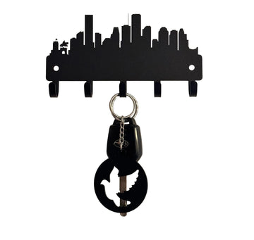A silhouette of Houston city skyline, cut from metal and with 5 hooks for hanging keys.