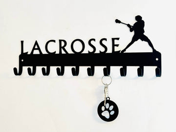Lacrosse-themed key holder with a silhouette of a player and the word 'Lacrosse'.