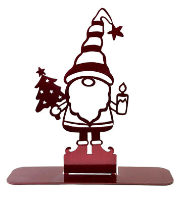 Gnome holding a Christmas tree and candle