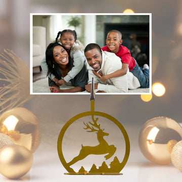 Decorative reindeer ornament with a family photo in the corner
