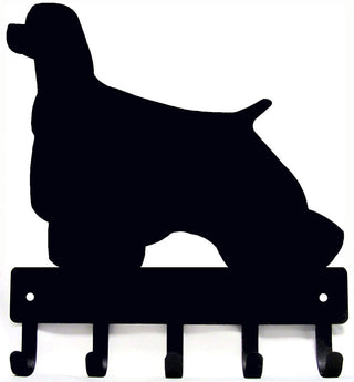A cocker spaniel dog silouette cut from metal, with 5 hooks for handing keys and leashes, and 2 holes for mounting it on the wall. 