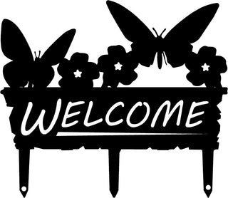 A welcome sign with butterflies on top and 3 stakes to put into the ground