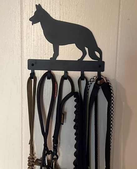 A metal leash hanger cut out in the shape of a German Shepherd. It has 5 hooks.