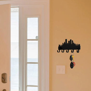 Pittsburgh City Skyline Key Holder on a wall next to a front door in a foyer