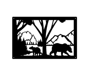A rectangular metal frame with bear, mountains, and trees cut from the metal.