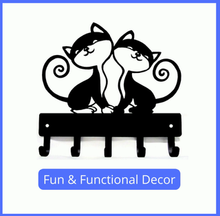 A metal key holder with 2 cartoon-style cats, with 5 hooks. The caption says fun and functional decor. 