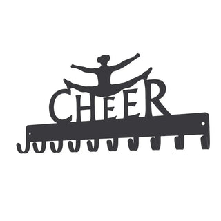 A medal hanger with the word Cheer above it and a girl doing a jump kick leap. It has 10 hooks for hanging medals.