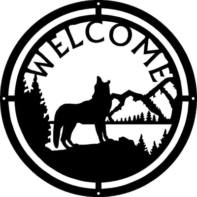 A round metal sign with a howling wolf and mountains in the background. The sign says WELCOME. 