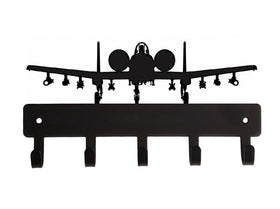 Black airplane-shaped wall hook on a white background