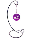 A purple keychain with the words You Matter cut from the metal.