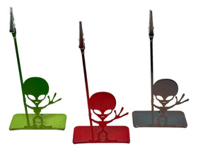 Three alien-shaped desk organizers in green, red, and brown on a white background