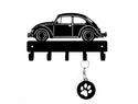 Wall hook with beetle car design and paw print keychain on a white background