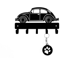 Wall hook with beetle car design and paw print keychain on a white background