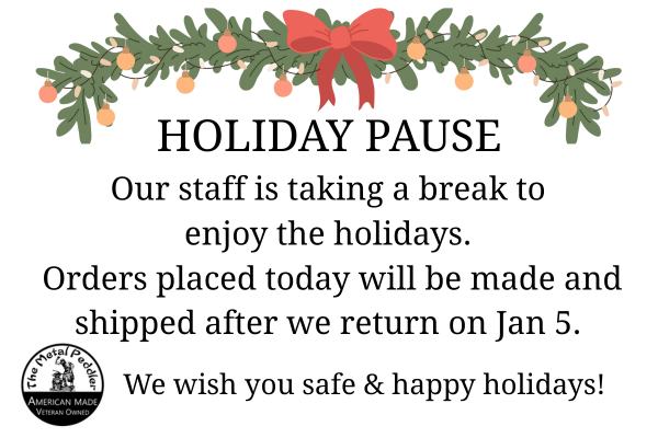 Holiday-themed message with greenery, a red bow, and text about staff taking a break.