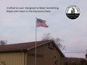American flag on a pole in front of a building with text and logo about 'The Metal Peddler'.