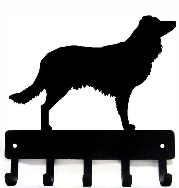 Black silhouette of an English Shepherd dog on a metal key rack with 5 hooks on a white background. The Metal Peddler