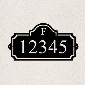 Heritage Monogram personalized metal address sign with custom house numbers on a stucco wall