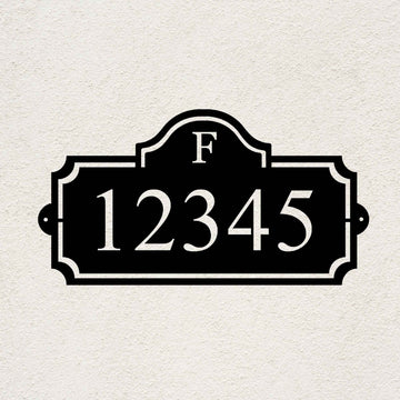 Heritage Monogram personalized metal address sign with custom house numbers on a stucco wall
