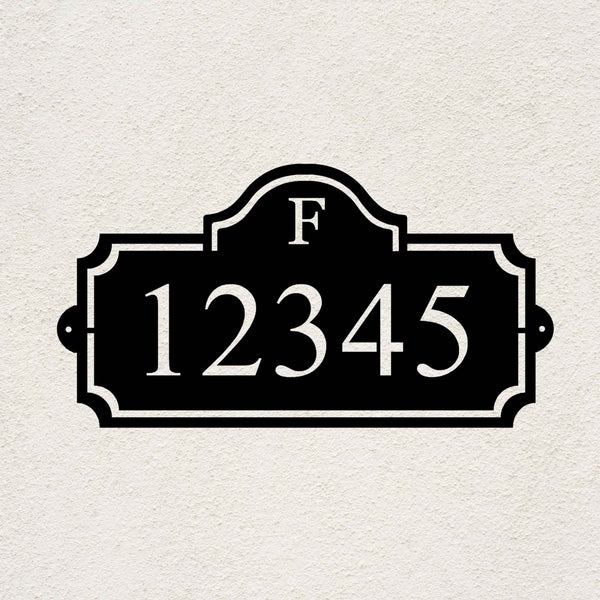 Heritage Monogram personalized metal address sign with custom house numbers on a stucco wall