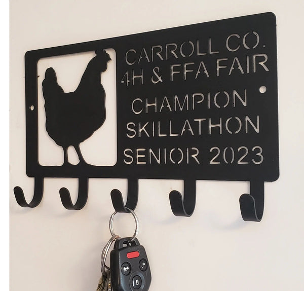 A custom Key Hanger with a Chicken design that says Carroll Co 4H & FFA Fair Champion Skillathon Senior 2023