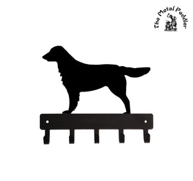 Black metal Flat-Coated Retriever dog silhouette with a key holder on a white background, branded 'The Metal Peddler'.