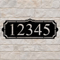 Address sign with a simple crest and large house numbers