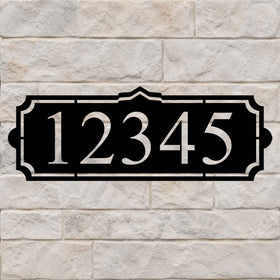Address sign with a simple crest and large house numbers