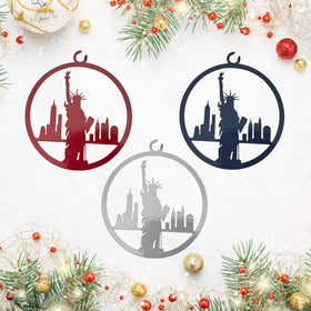 Three decorative cutouts of the Statue of Liberty on a festive background with Christmas ornaments.