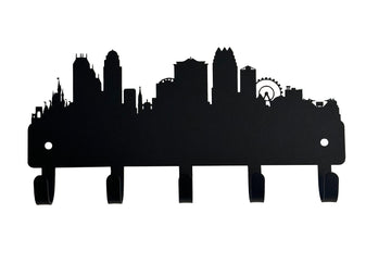 Orlando city skyline in silhouette, with skyscrapers, bridge, Disney castle, and ferris wheel of Icon park. Cut from metal and has 5 hooks to hang keys.