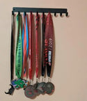 Plain medal hanger with 10 hooks and medals, wall mounted.