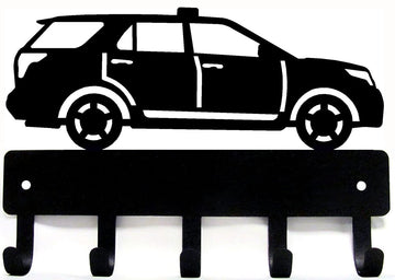 A key rack with a police vehicle laser cut from the metal and 5 hooks for hanging keys