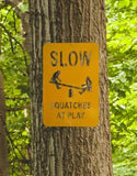 Yellow Warning Sign Squatches at Play - Fun Bigfoot Sign The Metal Peddler