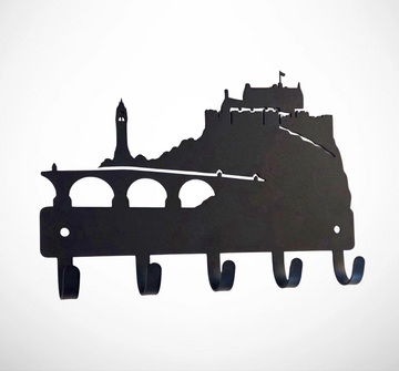 Black metal wall hook rack shaped like a city skyline with a castle and bridge silhouette, shown on a plain white background.