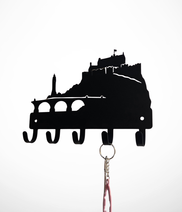 Black metal wall hook holder shaped like Stirling castle silhouette, with five hooks and a keychain hanging from the bottom, shown against a plain white background.