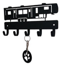 Key holder shaped like a RV with a key and paw print keychain attached on a white background
