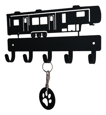 Key holder shaped like a RV with a key and paw print keychain attached on a white background