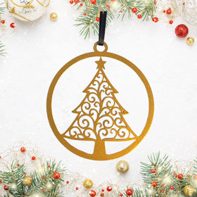 Decorative Christmas tree ornament with intricate cut-out design on a white background with festive decorations.