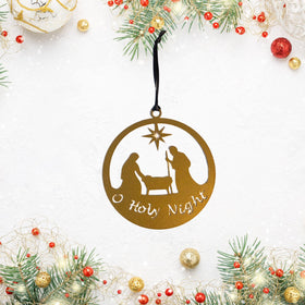 Decorative Christmas ornament with nativity scene and 'O Holy Night' text, surrounded by festive decorations.