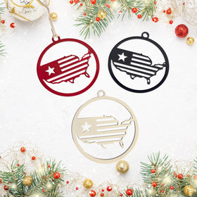 Three American flag-themed Christmas ornaments on a festive background with lights and decorations.