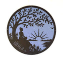 Decorative wall art with a silhouette of a person meditating under a tree, with a sunset in the background.