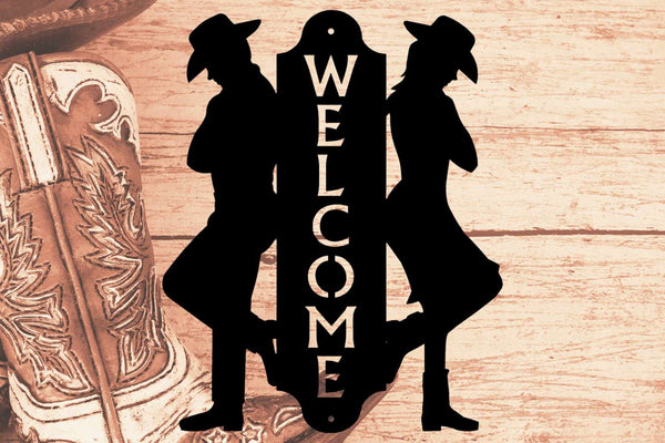 A welcome sign with a cowboy and cowgirl duo 