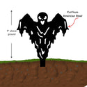 Black metal sculpture of a ghost figure above ground with text indicating height and material.