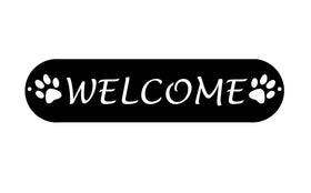Cylindrical shape with "welcome" in all capitals and a dog paw print on either end cut out