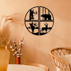 Decorative wall art with animal silhouettes on a beige wall.