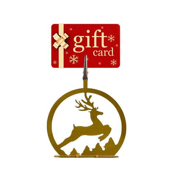 Gold reindeer ornament with a red 'gift card' sign on a white background