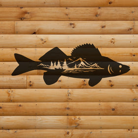 Black fish silhouette with mountain and tree design on a wooden background