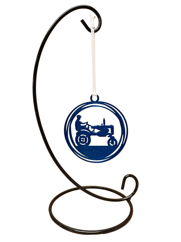 Metal Christmas ornament with a tractor. Color blue