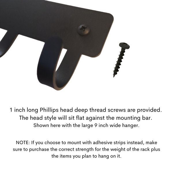 Shows a black screw in the mounting hole. 1 inch long philips head screws.
